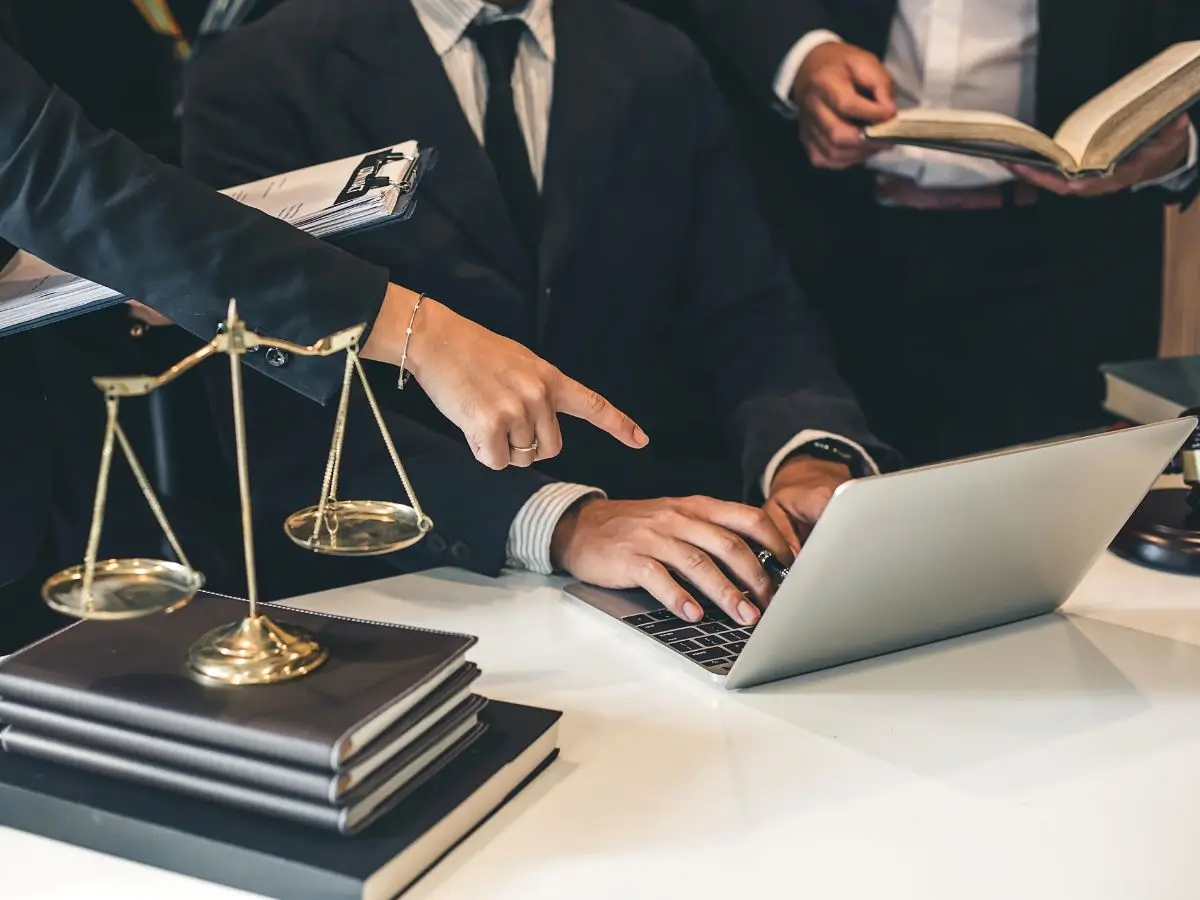 Lawyers reviewing domestic violence case documents in an office