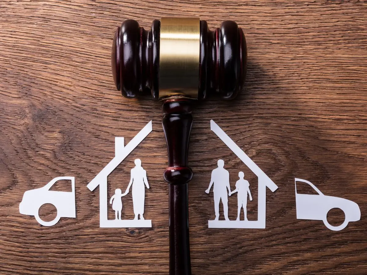 Gavel and family cutouts symbolizing domestic violence and custody disputes